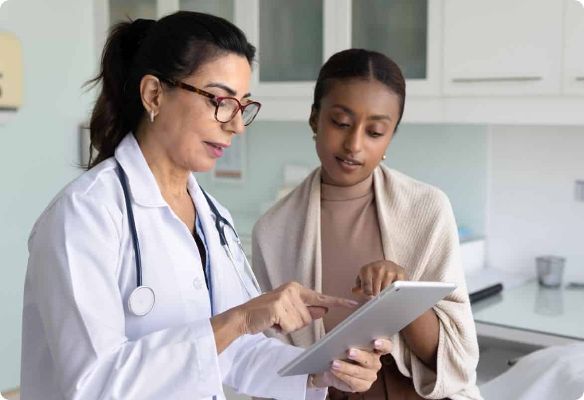 Healthcare professional patient consultation tablet discussion