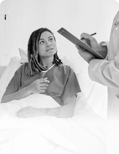 Hospital patient bed doctor clipboard care